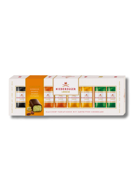 Niederegger Marzipan Klassiker-Variationen 100 g – Pralinen mit Zartbitter-Schokolade in den Sorten Pistazie, Orange, Ananas und Espresso, erhältlich in der Dreyer Confiserie in der Rattenfängerstadt Hameln.