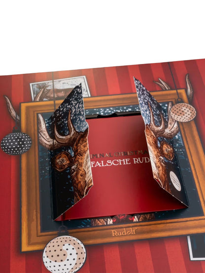 Inhalt des PETERS Criminal Christmas Adventskalenders „Der falsche Rudolf“ 255 g – vielfältige Pecarée-Pralinen-Spezialitäten auf einem Teller präsentiert.