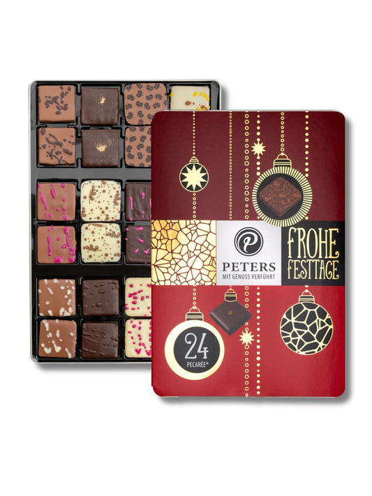 Frohe Festtage 24er Pecarée ®-Mischung 255 g von Peters Pralinen – edle Metalldose mit 24 Trüffeltäfelchen in 12 Sorten wie Cassis-Marc de Champagne, Cappuccino, Prosecco-Himbeere und Macadamia-Creme, erhältlich in der Dreyer Confiserie in der Rattenfängerstadt Hameln.