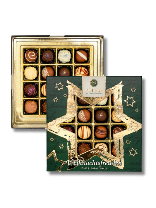 Weihnachtsfreuden Trüffelauslese 200 g von Peters Pralinen – luxuriöse Sternpackung mit 13 edlen Trüffel- und Pralinensorten wie Marc de Champagne, Rum, Riesling und Tiramisu, erhältlich in der Dreyer Confiserie in der Rattenfängerstadt Hameln.