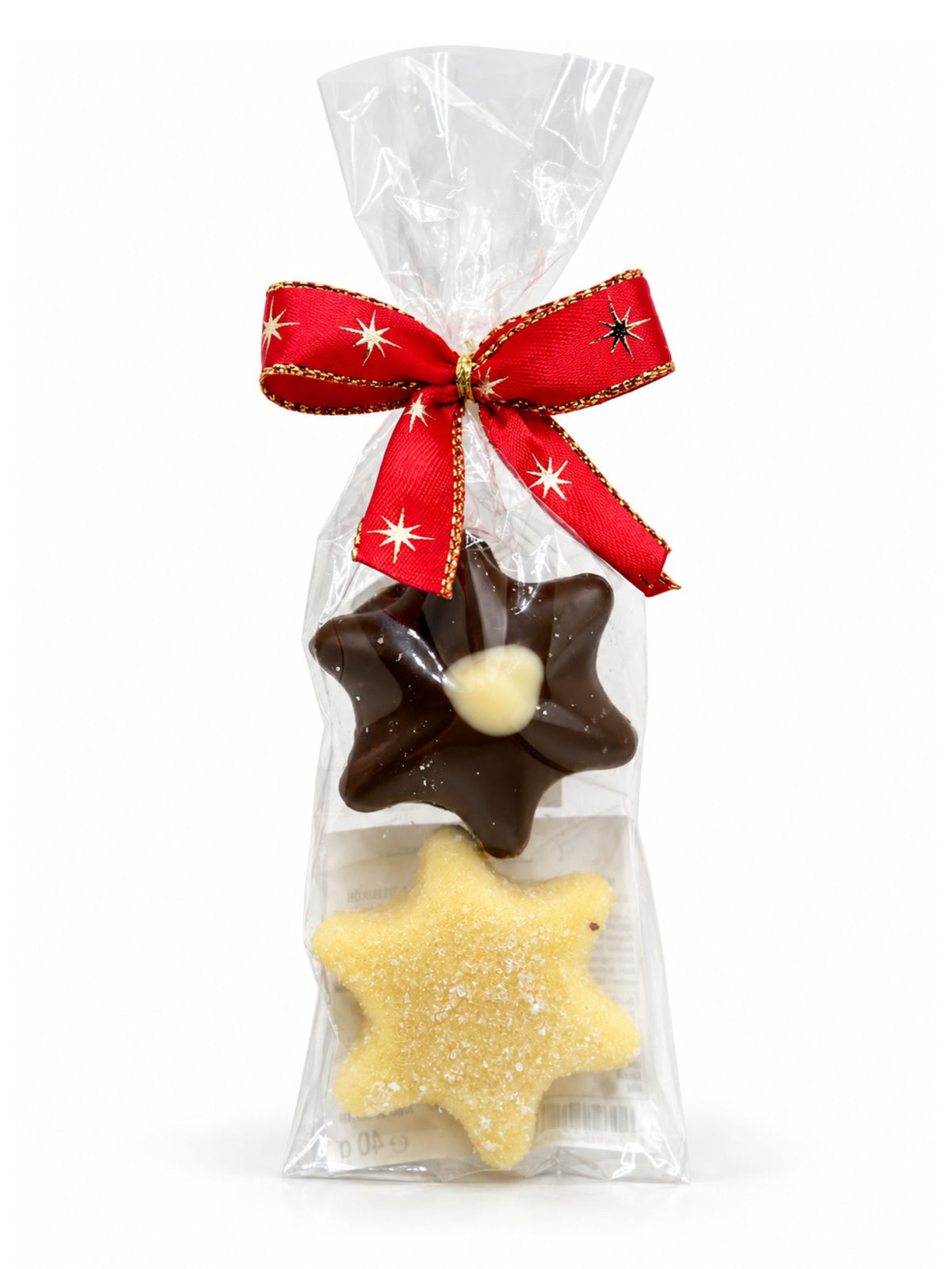 Maxi-Trüffelstern Duo Champagner und Eierlikör 40g von Wagner Pralinen mit zwei Schokoladensternen in transparenter Geschenkfolie und roter Weihnachtsschleife