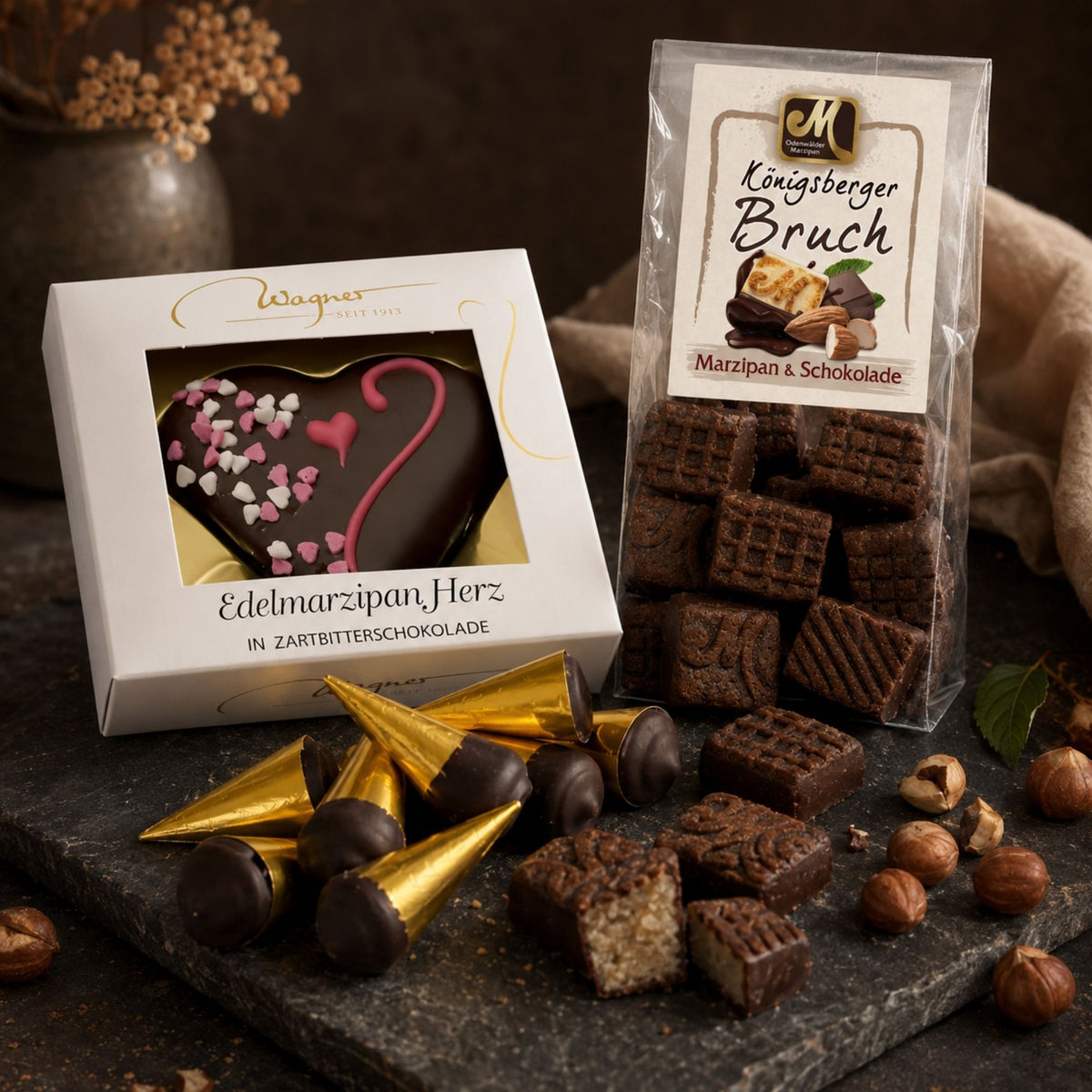 Haselnussnougat und schokoliertes Marzipan auf dunklem Holz