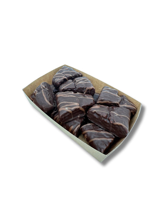 Feiner Spitzkuchen 125 g – saftiger Lebkuchen mit Zartbitter- und Vollmilchschokolade, ideal für den bunten Teller und erhältlich in der Dreyer Confiserie in der Rattenfängerstadt Hameln.