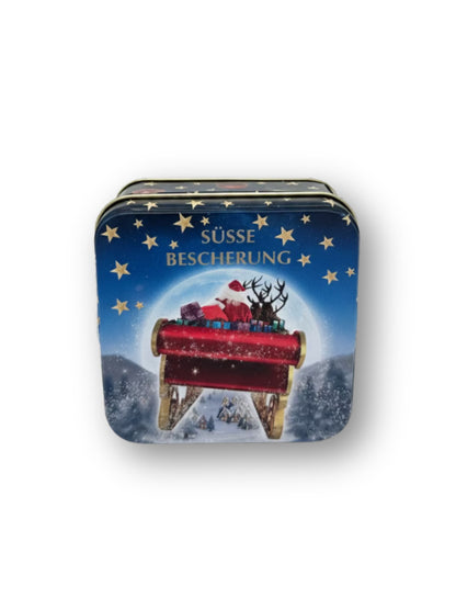 Präsentdose „Süße Bescherung“ 50 g – feine handgefertigte Pralinenmischung in festlicher Metalldose mit Weihnachtsmotiv, erhältlich bei der Dreyer Confiserie in Hameln.