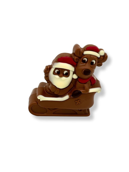 Santa & Elch Weihnachtsexpress 110g – detailreich gestaltete Schokoladenfigur aus Edelvollmilch-, weißer und Zartbitterschokolade, erhältlich in der Dreyer Confiserie in der Rattenfängerstadt Hameln.
