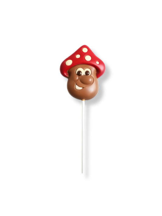 Schokoladen Lolli „Pilz“ 30g von Meynendonckx – liebevoll dekorierter Vollmilchschokoladen-Lolli in Pilzform mit farbiger Dekormasse, erhältlich in der Dreyer Confiserie in der Rattenfängerstadt Hameln.