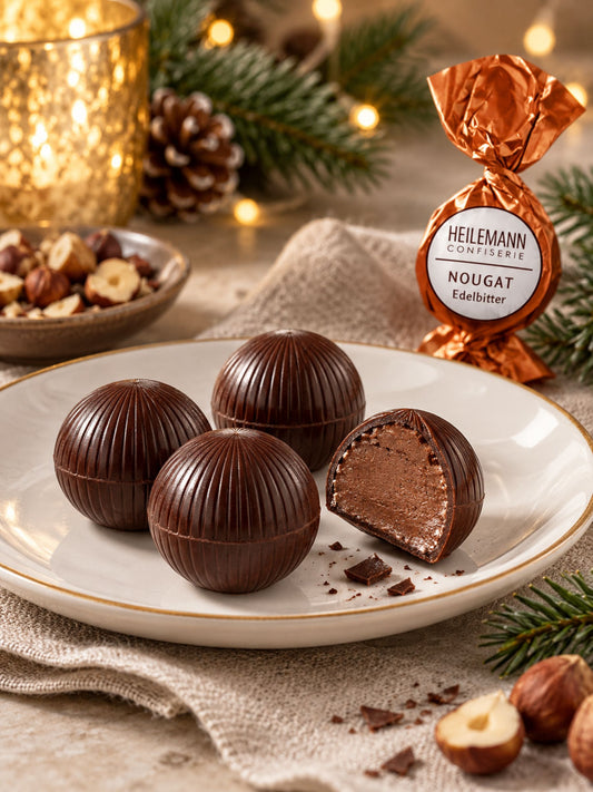 Nougat Edelbitter Praliné-Kugel 15g von Heilemann ausgepackt auf Teller
