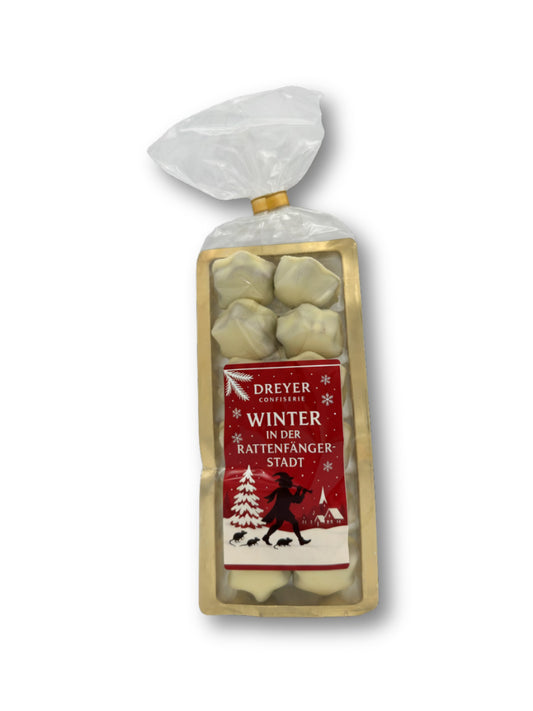 Verpackung "Winter in der Rattenfängerstadt" von Confiserie Rabbel Zimtsterne mit weißer Schokolade 125 g – feines Weihnachtsgebäck aus Mandeln, Haselnüssen und Zimt, überzogen mit zarter weißer Schokolade, erhältlich in der Dreyer Confiserie in Hameln.
